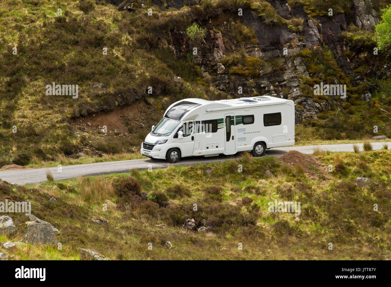 Motorhome on narrow mountain road in Scottish highlands Stock Photo