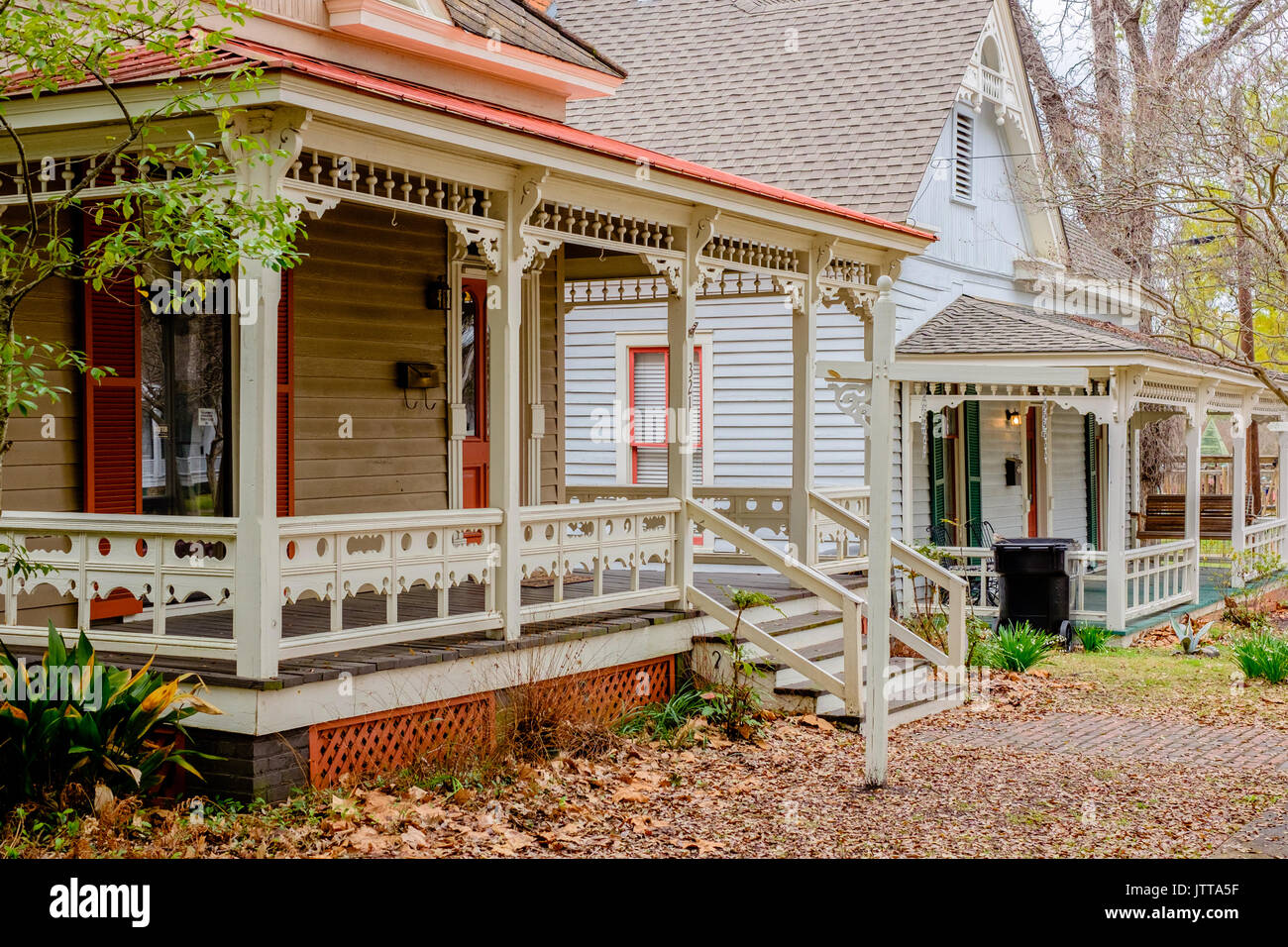 Victorian style homes along a residential street in the fall. Stock Photo
