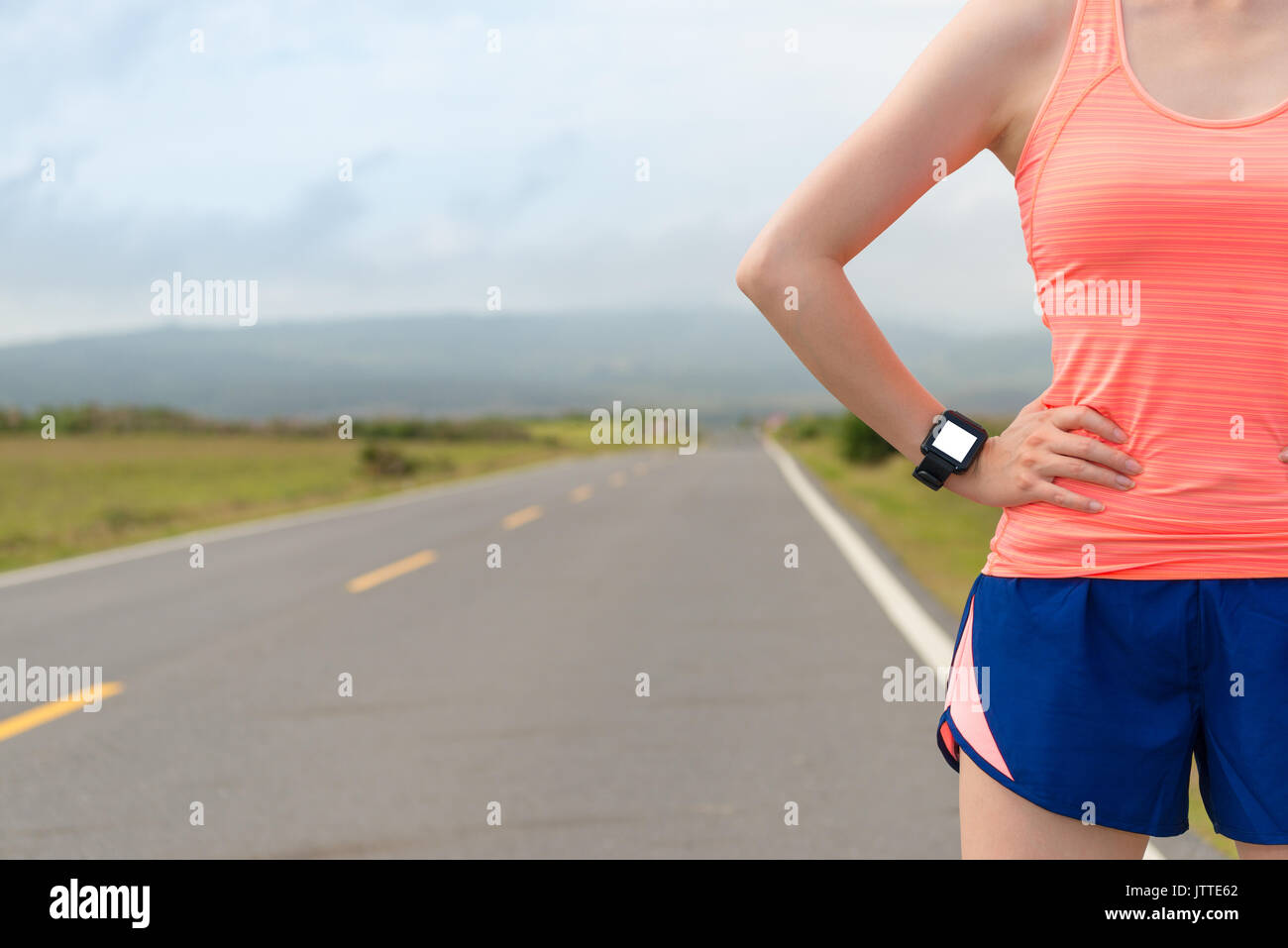 portrait of professional athlete wearing sport heart rate smartwatch for workout fitness and