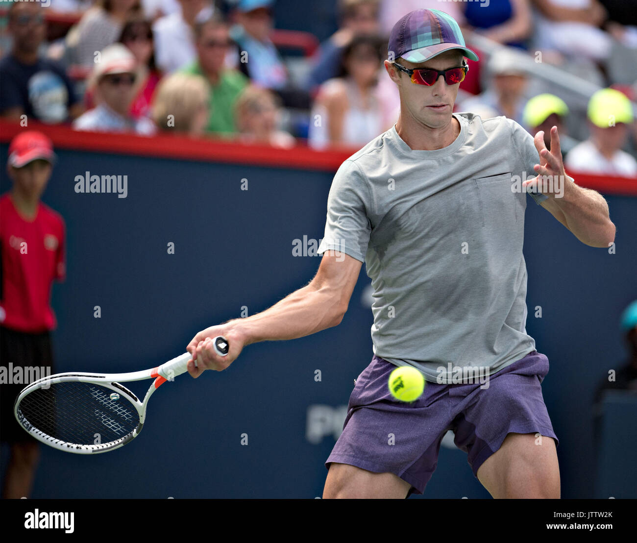 Montreal, Canada. 9th Aug, 2017. Peter Polansky of Canada returns to ...