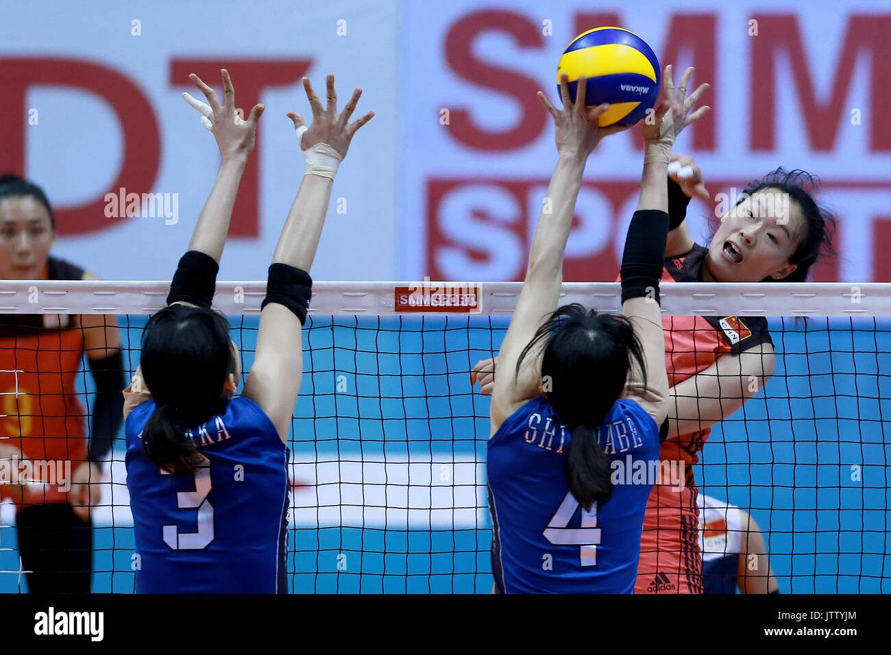 Laguna Province, Philippines. 10th Aug, 2017. Cai Xiao Qing of China (R) competes against Nana Iwasaka (L) and Risa Shinnabe of Japan during their preliminary round match in the 2017 Asian Women's Volleyball Championship in Laguna Province, the Philippines, Aug. 10, 2017. Japan won 3-0. Credit: Rouelle Umali/Xinhua/Alamy Live News Stock Photo