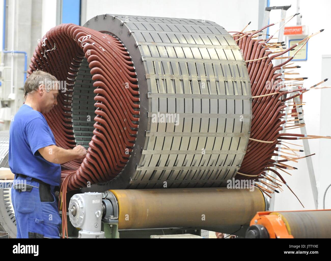 Employee works during the visit of Czech Prime Minister Bohuslav Sobotka in the production plant Siemens Electric Machines, which produces electric motors and generators, in Drasov, Brno region, Czech Republic, on August 10, 2017. (CTK Photo/Igor Zehl) Stock Photo