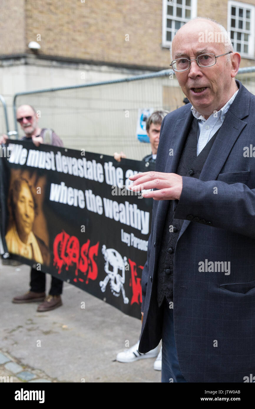 London, UK. 10th August, 2017. Ian Bone of Class War is interviewed during a protest outside Duke's Lodge in Holland Park, an empty apartment block believed to be owned by Christian Candy’s Guernsey-based CPC Group, to draw attention to social housing required by former residents of the Grenfell block in North Kensington. Credit: Mark Kerrison/Alamy Live News Stock Photo