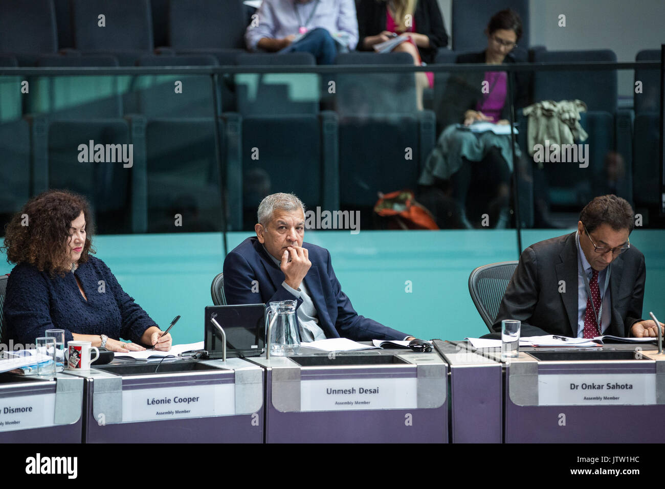 London, UK. 10th August, 2017. London Assembly Members Leonie Cooper, Unmesh Desai and Dr Onkar Sahota listen to Mayor of London Sadiq Khan responding to questions during Mayor's Question Time at City Hall. Among topics discussed were: acid attacks, social housing, expenditure on fire and police services, 4G coverage on underground trains and noise from overnight underground trains. Credit: Mark Kerrison/Alamy Live News Stock Photo