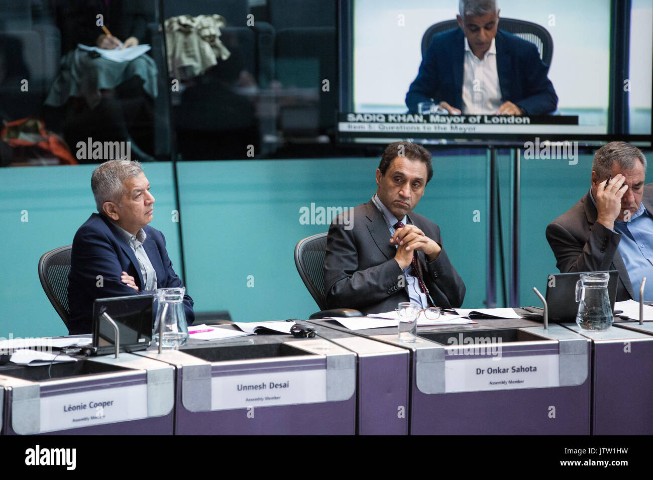 London, UK. 10th August, 2017. London Assembly Members Unmesh Desai, Dr Onkar Sahota and Len Duvall listen to Mayor of London Sadiq Khan responding to questions during Mayor's Question Time at City Hall. Among topics discussed were: acid attacks, social housing, expenditure on fire and police services, 4G coverage on underground trains and noise from overnight underground trains. Credit: Mark Kerrison/Alamy Live News Stock Photo