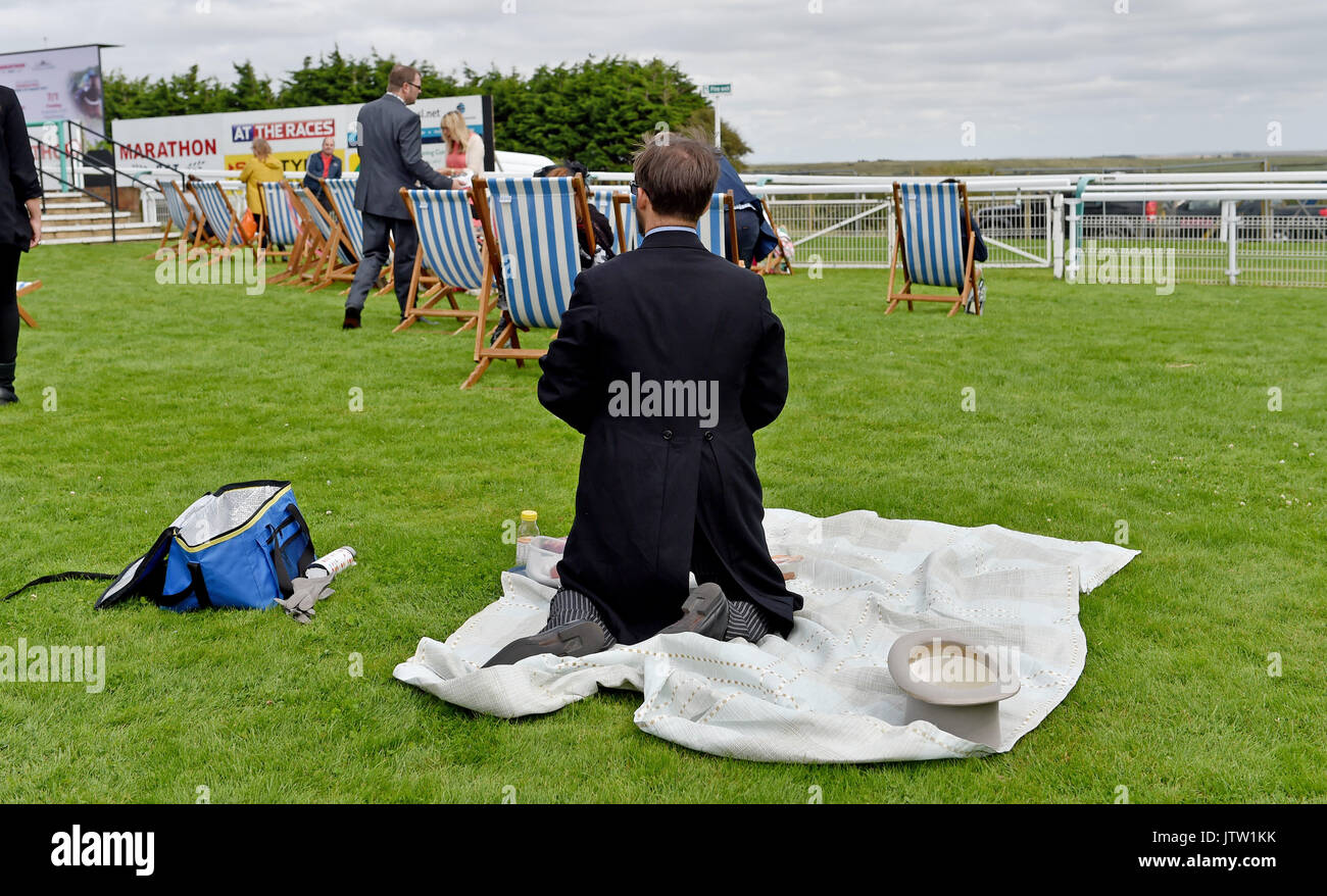 Brighton, UK. 10th Aug, 2017. Racegoers enjoying themselves at Brighton Races Route Mobile Ladies Day during the three day Maronthonbet Festival of Racing Credit: Simon Dack/Alamy Live News Stock Photo