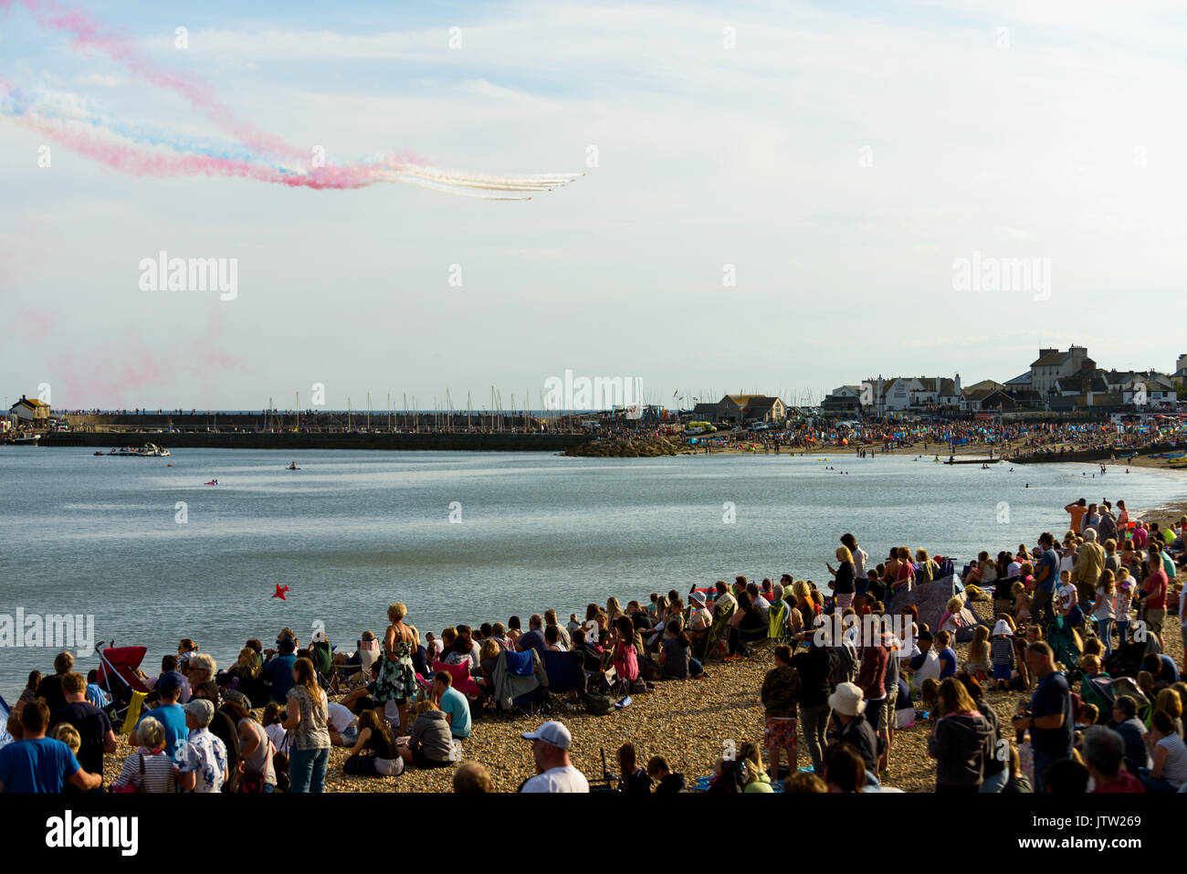 **Lyme Regis, Dorset, UK. 10th Aug 2017. The RAF Red arrows dazzle