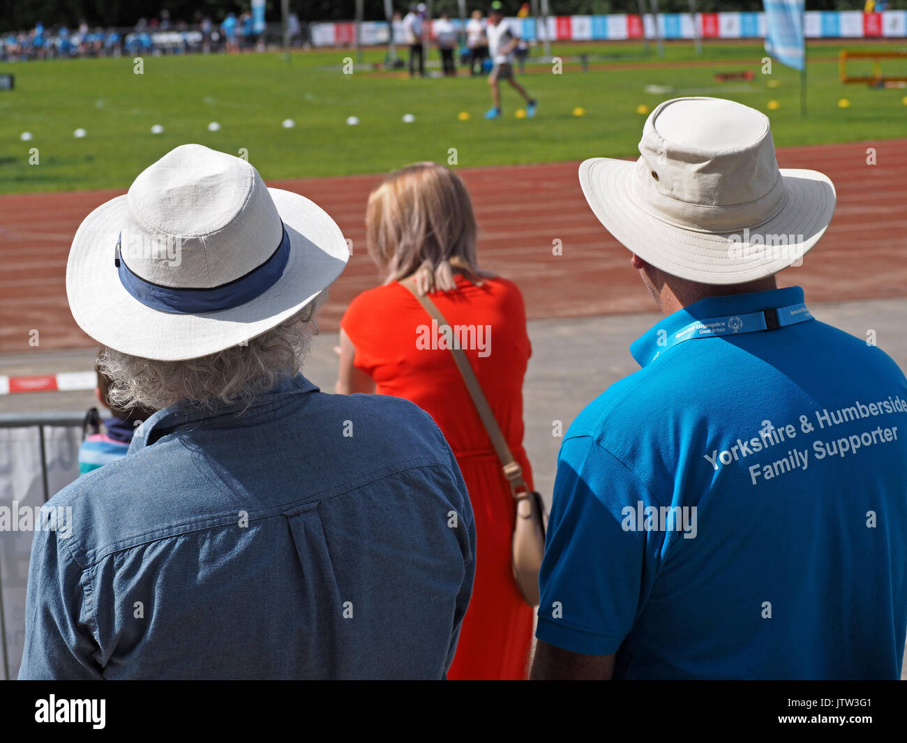 Sheffield, UK. 10th August, 2017. Spectators in sunhats watching athletics at Special Olympics National Games in Sheffield in sunshine Credit: Steve Holroyd/Alamy Live News Stock Photo