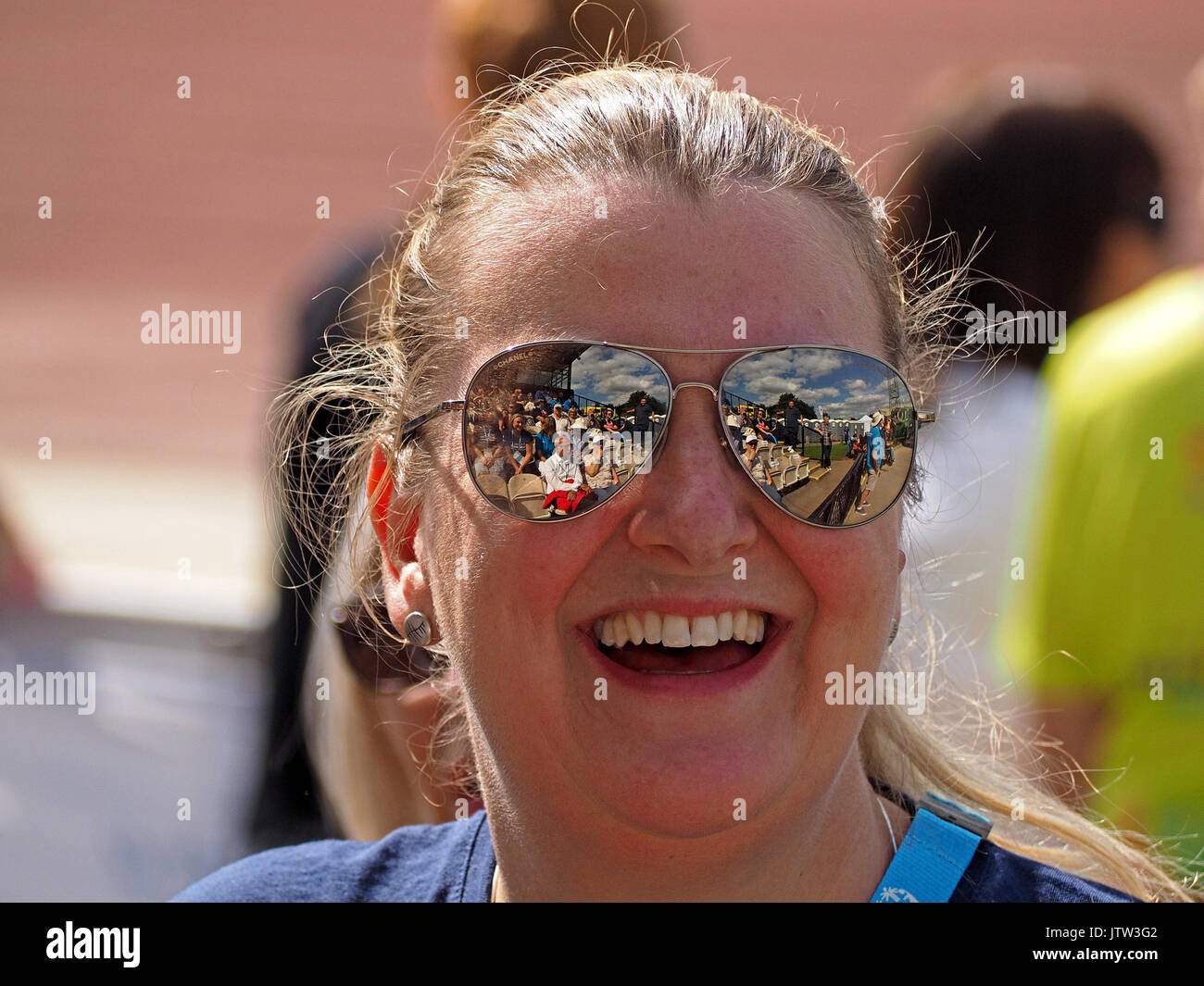 Sheffield, UK. 10th August, 2017. Spectators refelected in sunglasses of one supporter at Special Olympics National Games in Sheffield Credit: Steve Holroyd/Alamy Live News Stock Photo