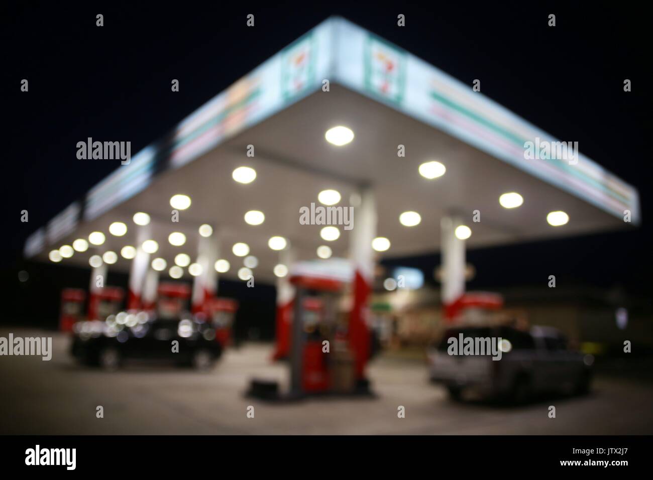Gas Station Out of Focus in Twilight Good Wallpaper Background Stock Photo  - Alamy