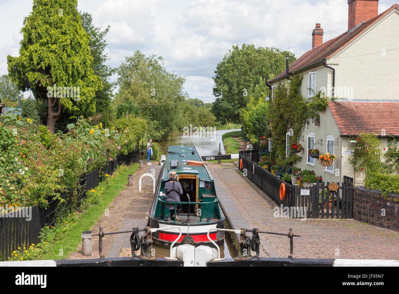 Boating on the Worcester & Birmingham Canal at Astwood lock, Worcestershire, England, UK Stock Photo