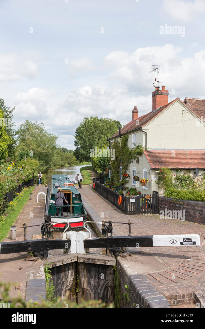 Boating on the Worcester & Birmingham Canal at Astwood lock, Worcestershire, England, UK Stock Photo