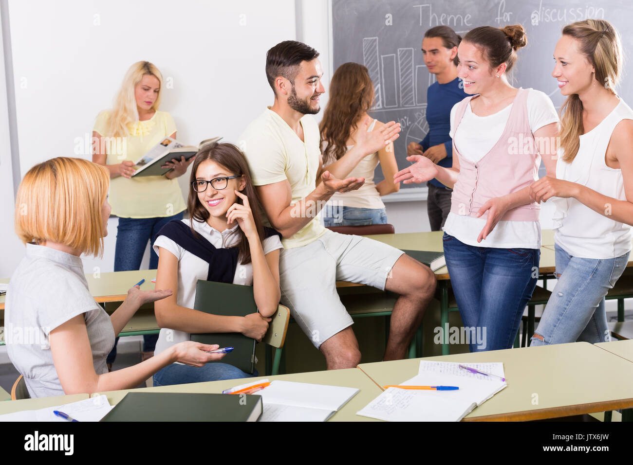 happyl students chatting and smiling at the college Stock Photo - Alamy