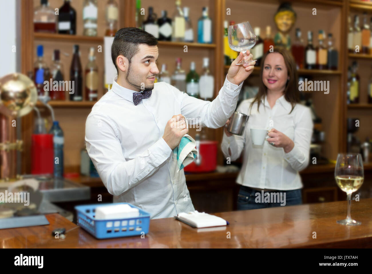 young bar staff working at the customer service counter Stock Photo