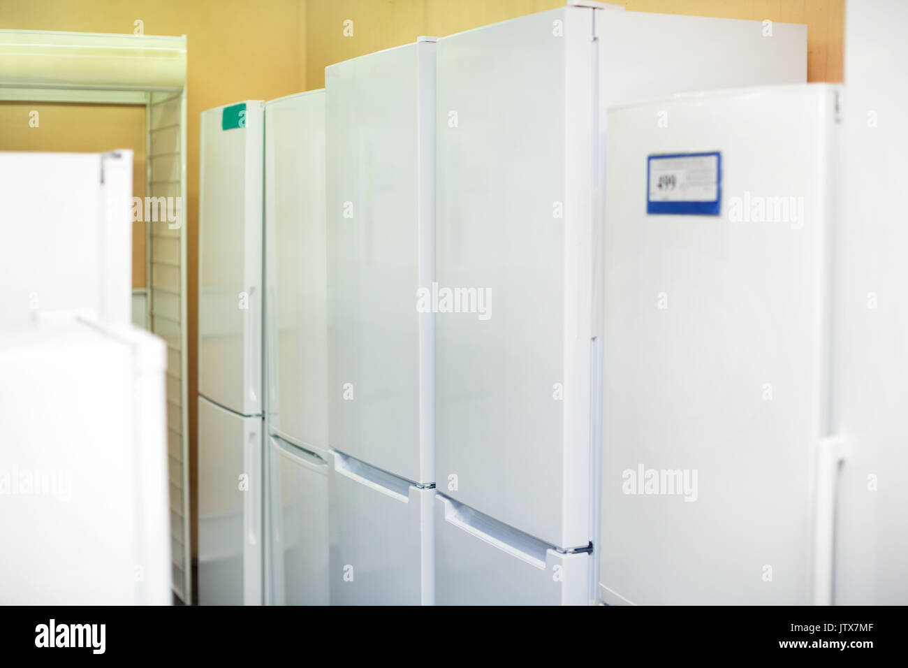 Modern white domestic refrigerators with automatic defrosting system in