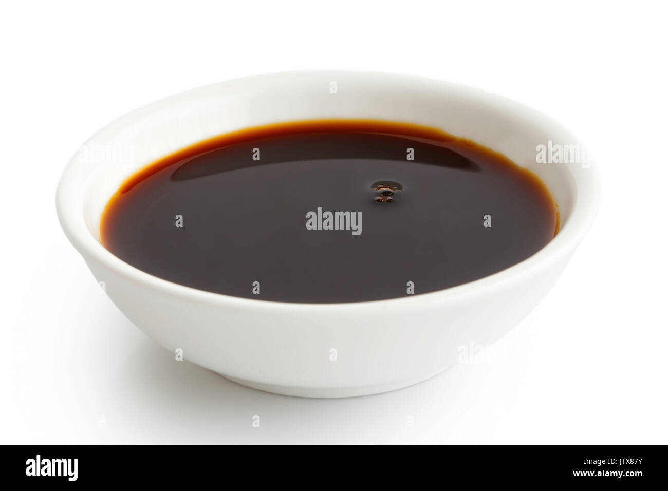 Soya sauce in white ceramic bowl isolated on white Stock Photo Alamy