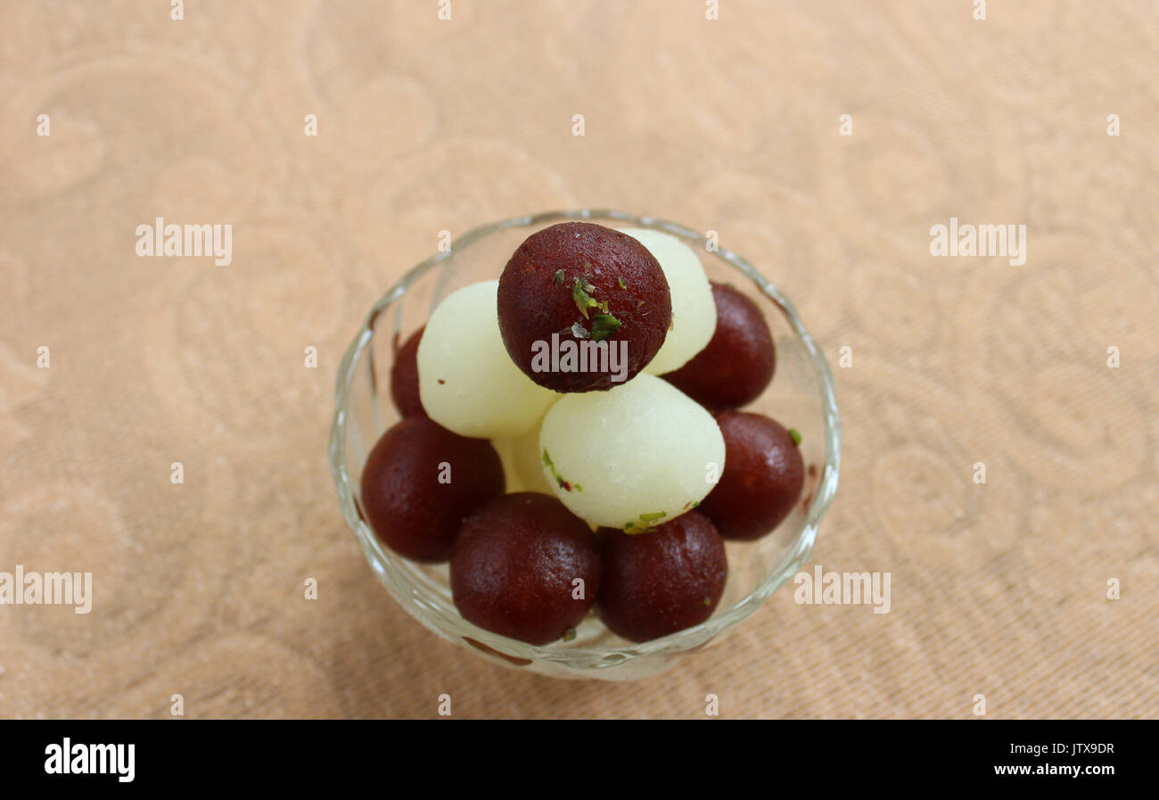 gulab jamun and rasgulla lying over one another in a glass bowl stock photo alamy https www alamy com gulab jamun and rasgulla lying over one another in a glass bowl image153012883 html