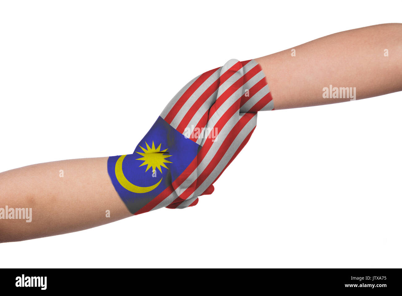 Helping hands of two children with Malaysia flag painted in isolated white background Stock Photo