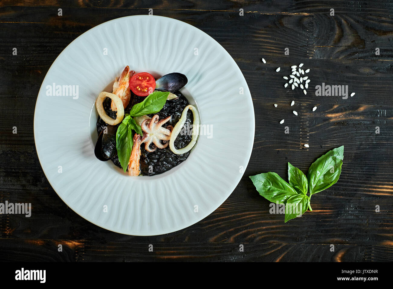 Black risotto squid on plate hi-res stock photography and images - Alamy