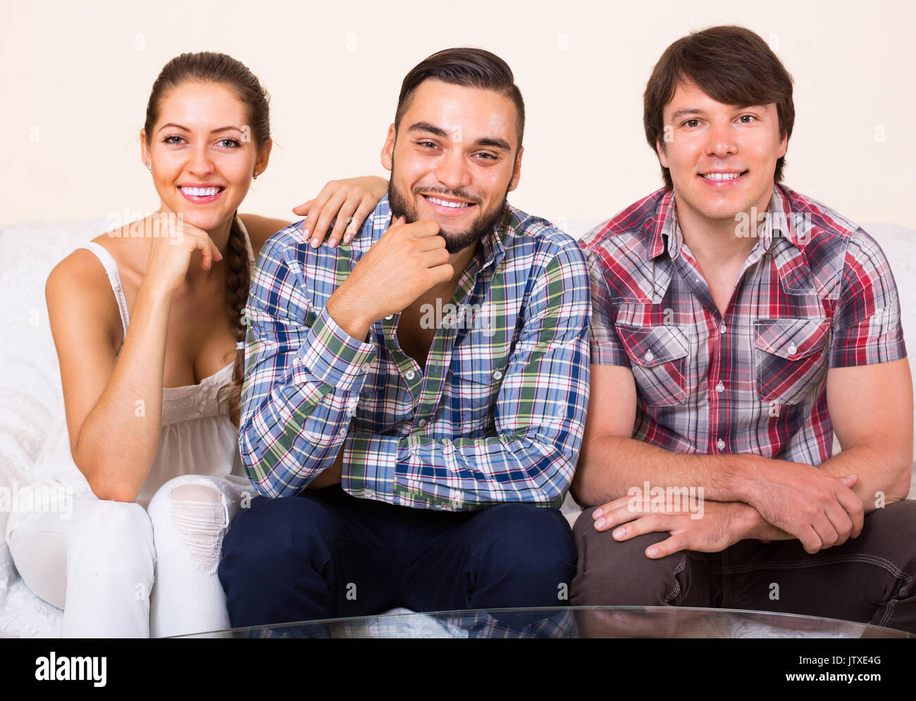 Portrait of happy young polygamous family posing at home Stock Photo ...