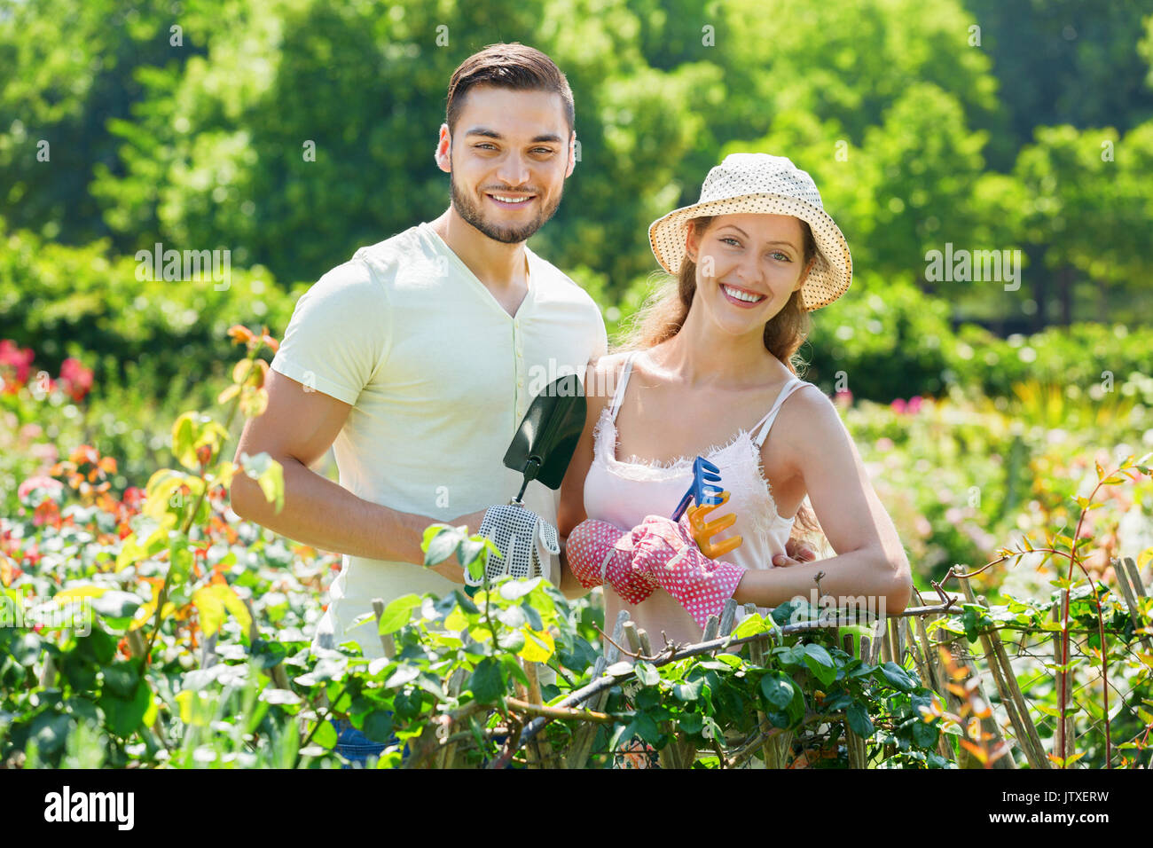 Gardener couple house tree hi-res stock photography and images - Alamy