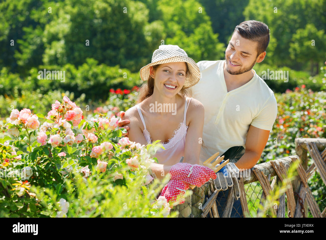 Gardener couple house tree hi-res stock photography and images - Alamy