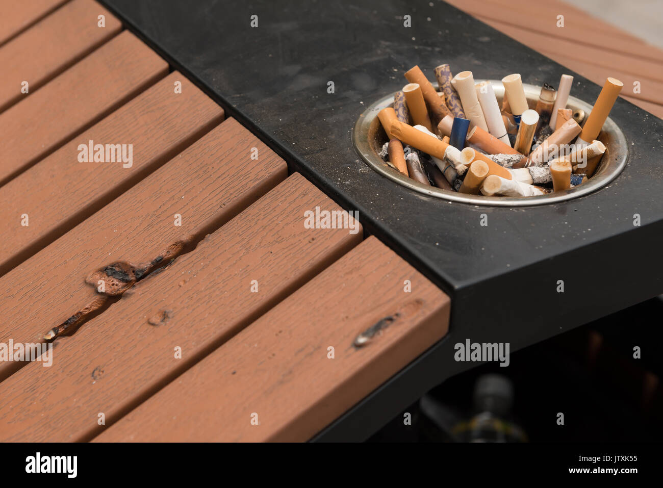 cigarette ends in a trash bin Stock Photo