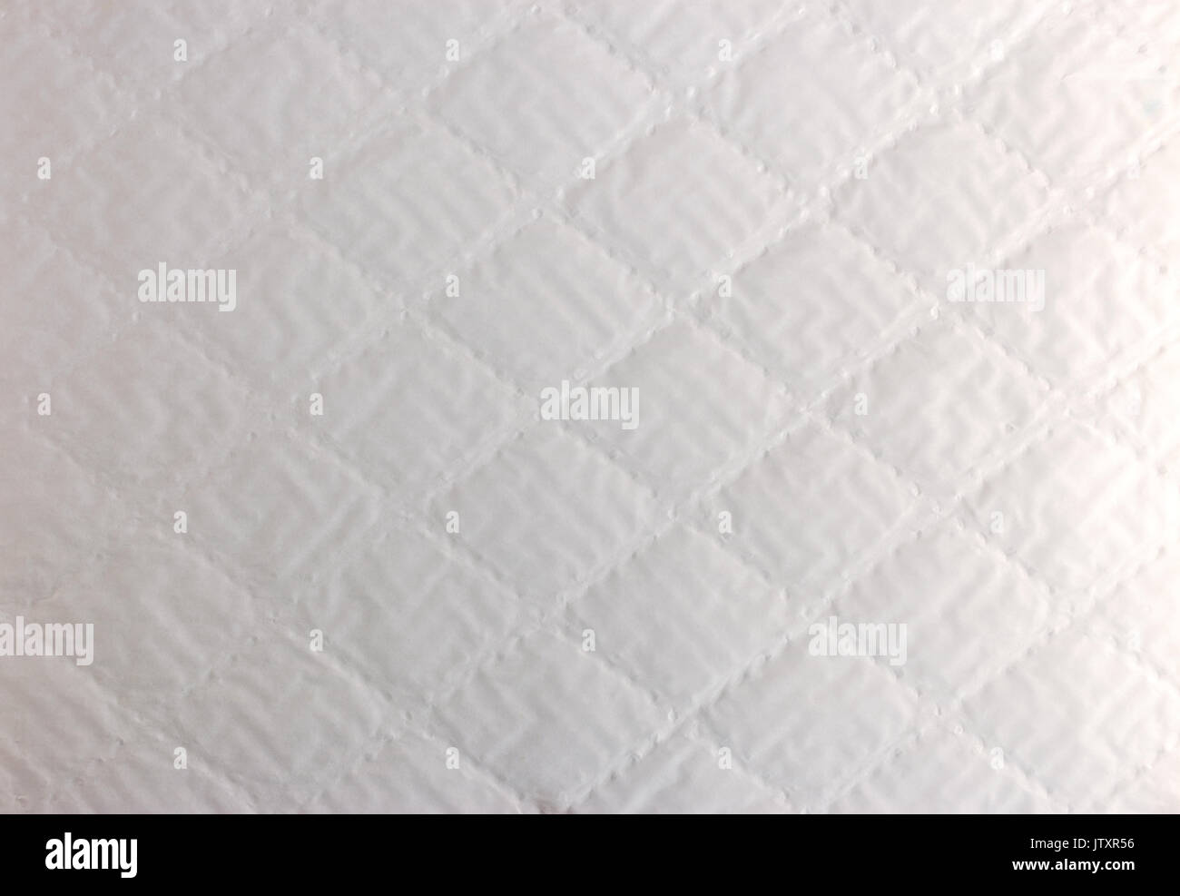 abstract background texture of white bumpy paper with rhombus pattern Stock Photo