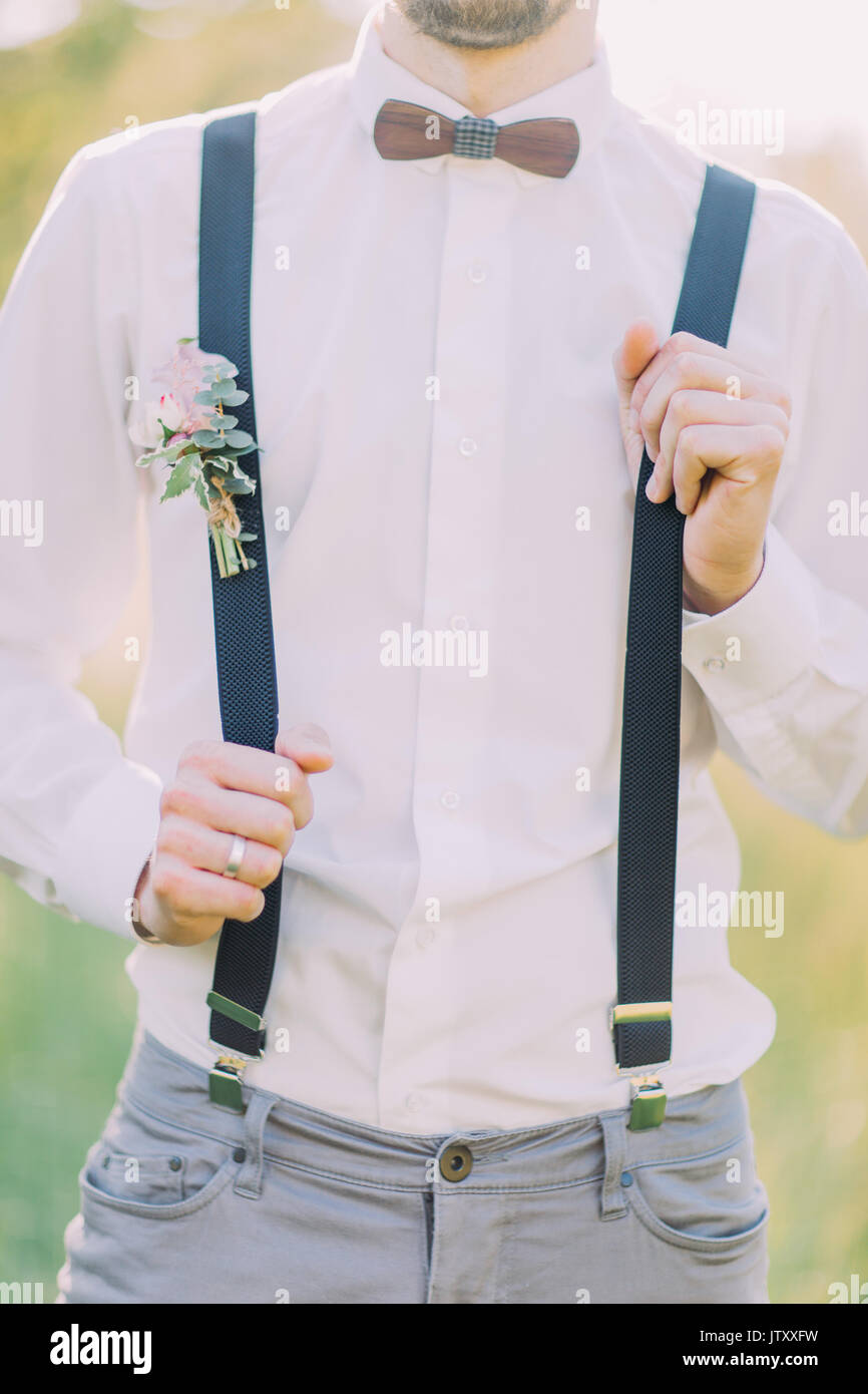 outlook of the groom in the white shirt 