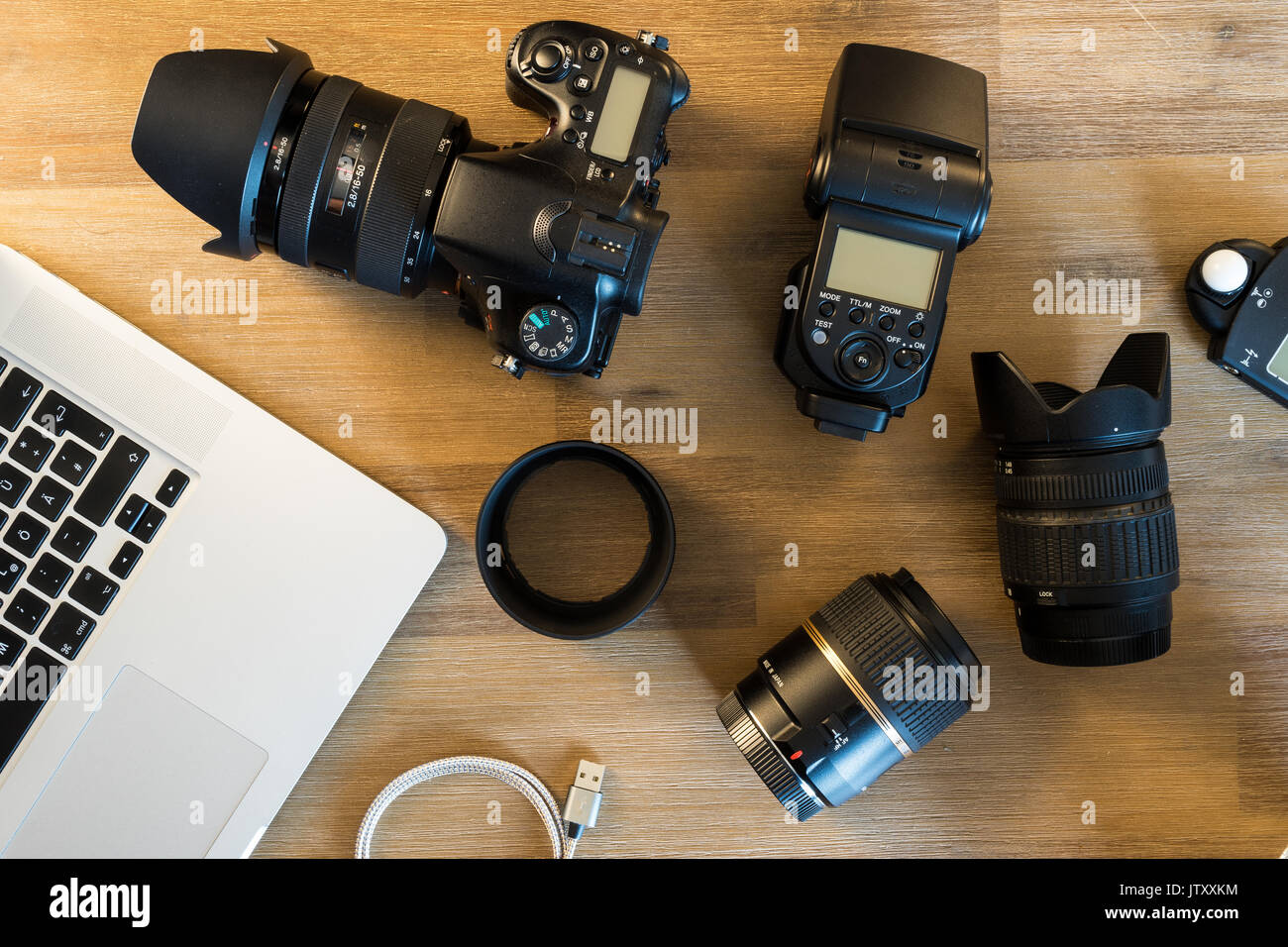 desktop with photography equipment, camera, lenses Stock Photo