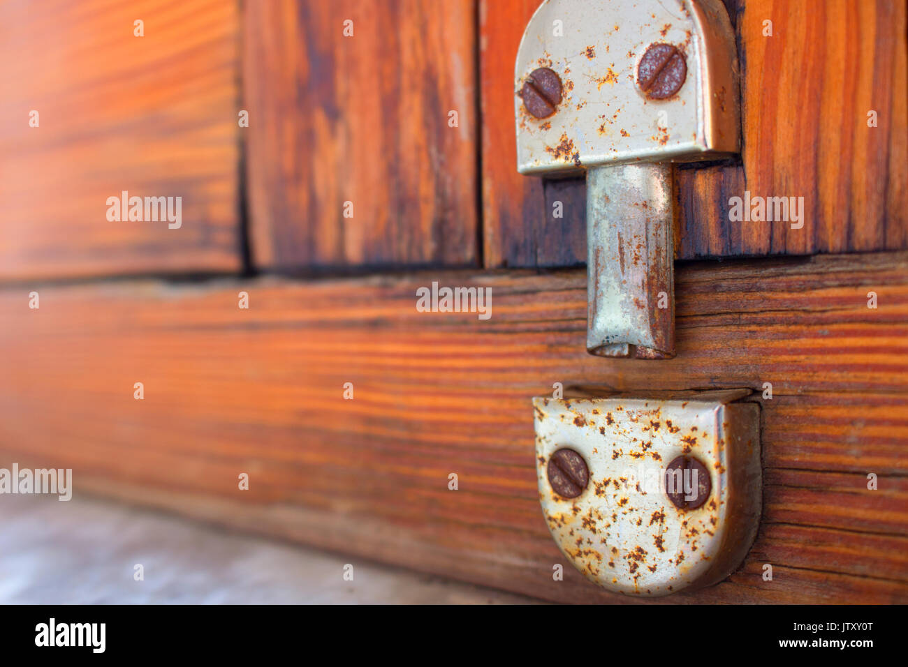 Lock. Old window lock. Traditional Spanish design. Wooden Stock Photo