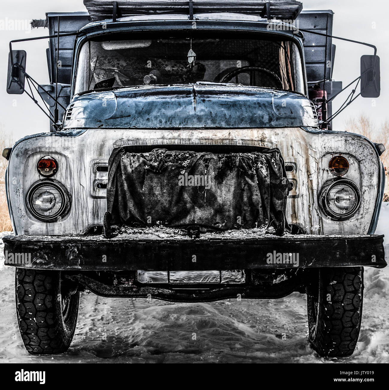 Old grunge soviet truck. Old truck background. Front view. Grunge truck. Lorry. Truck Stock Photo