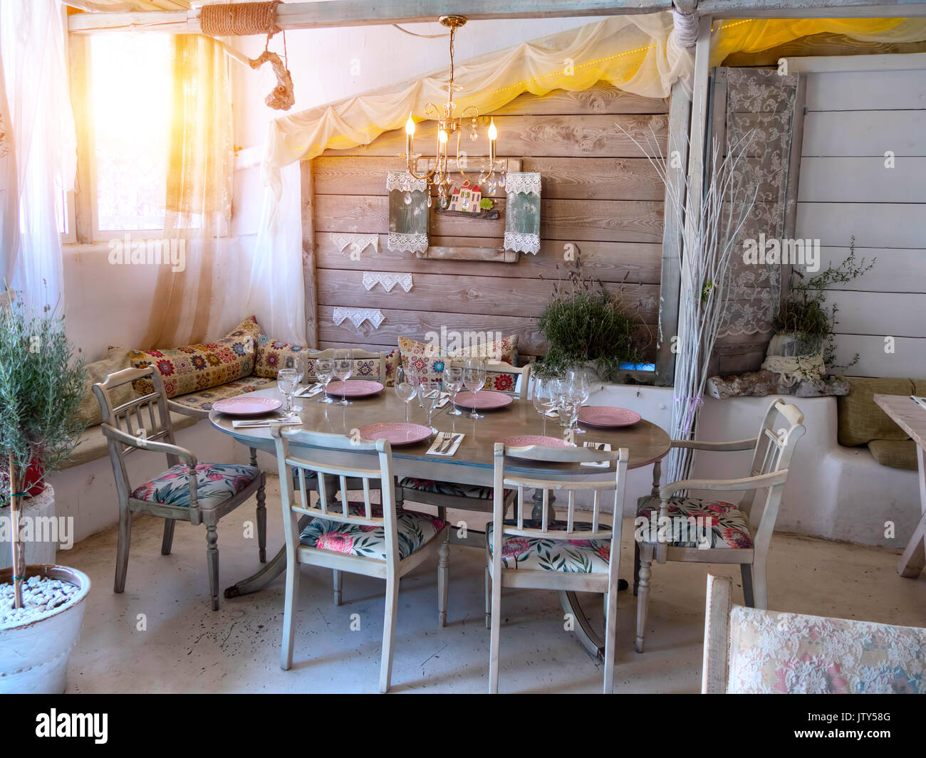 A small dining room in a rustic house, in an old style. Stock Photo