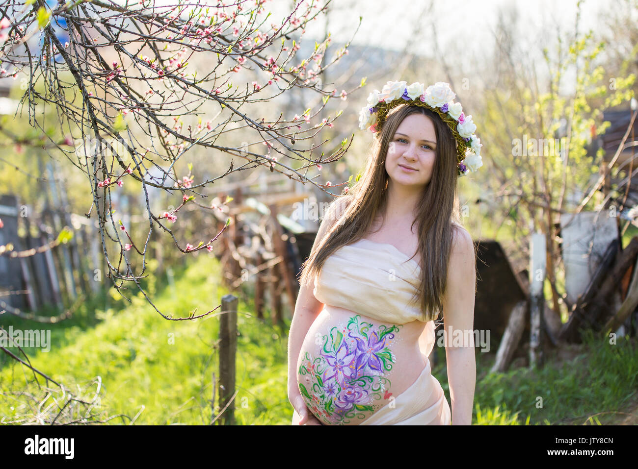 The pregnant girl on walk in city park Stock Photo - Alamy