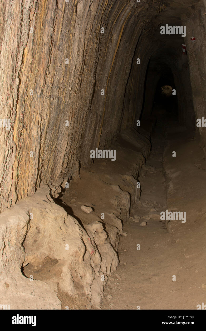 In the ancient Roman place Eleutherna  in central Crete a calcareous sintered tunnel leads to the cistern of the town. Stock Photo