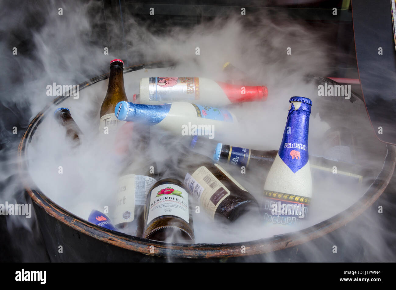 Bottles of beer in a barrel with dry ice. Stock Photo