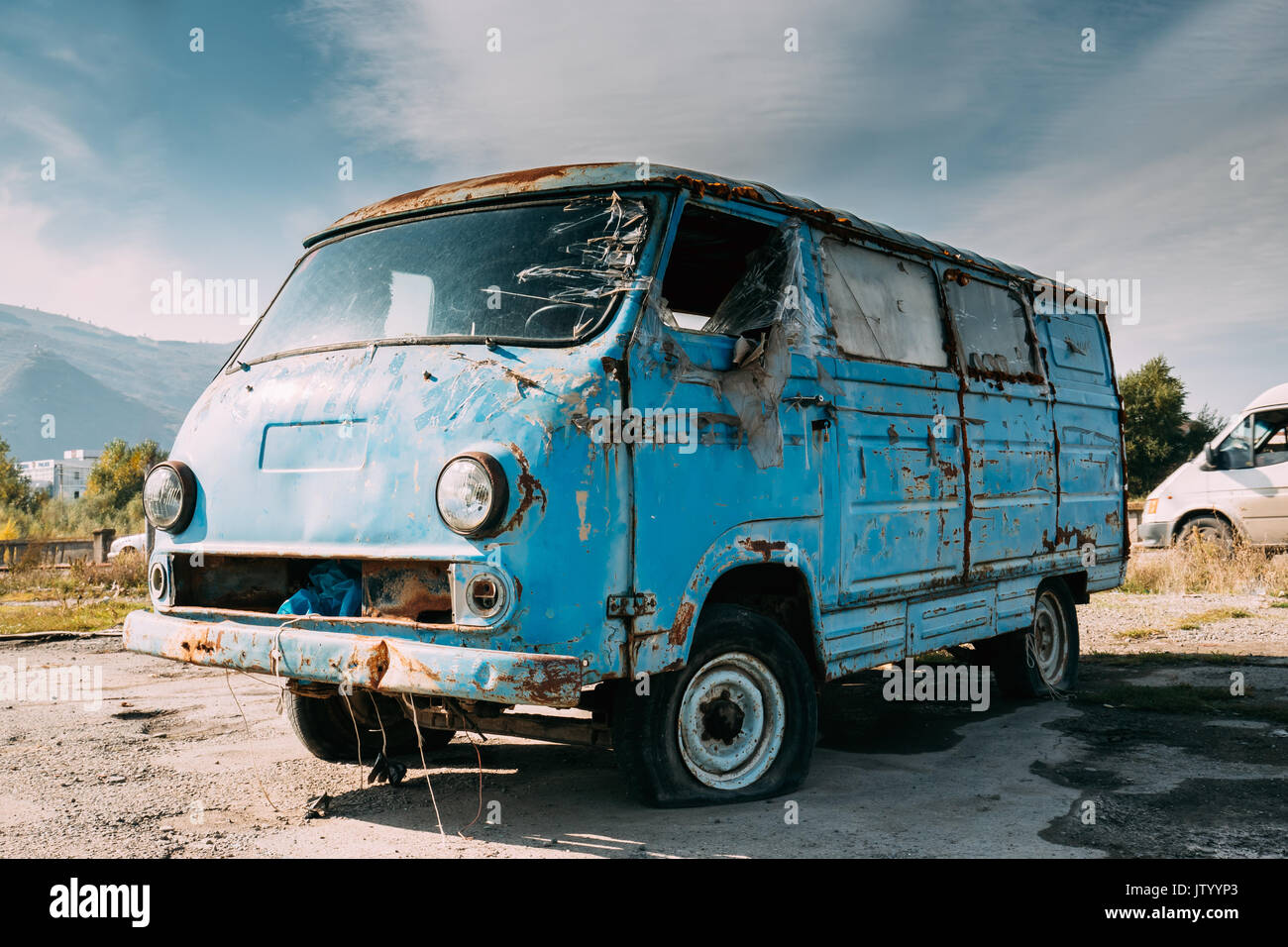 Old Broken Abandoned Mini Bus Car Vehicle In Countryside. Car Wreck Stock Photo