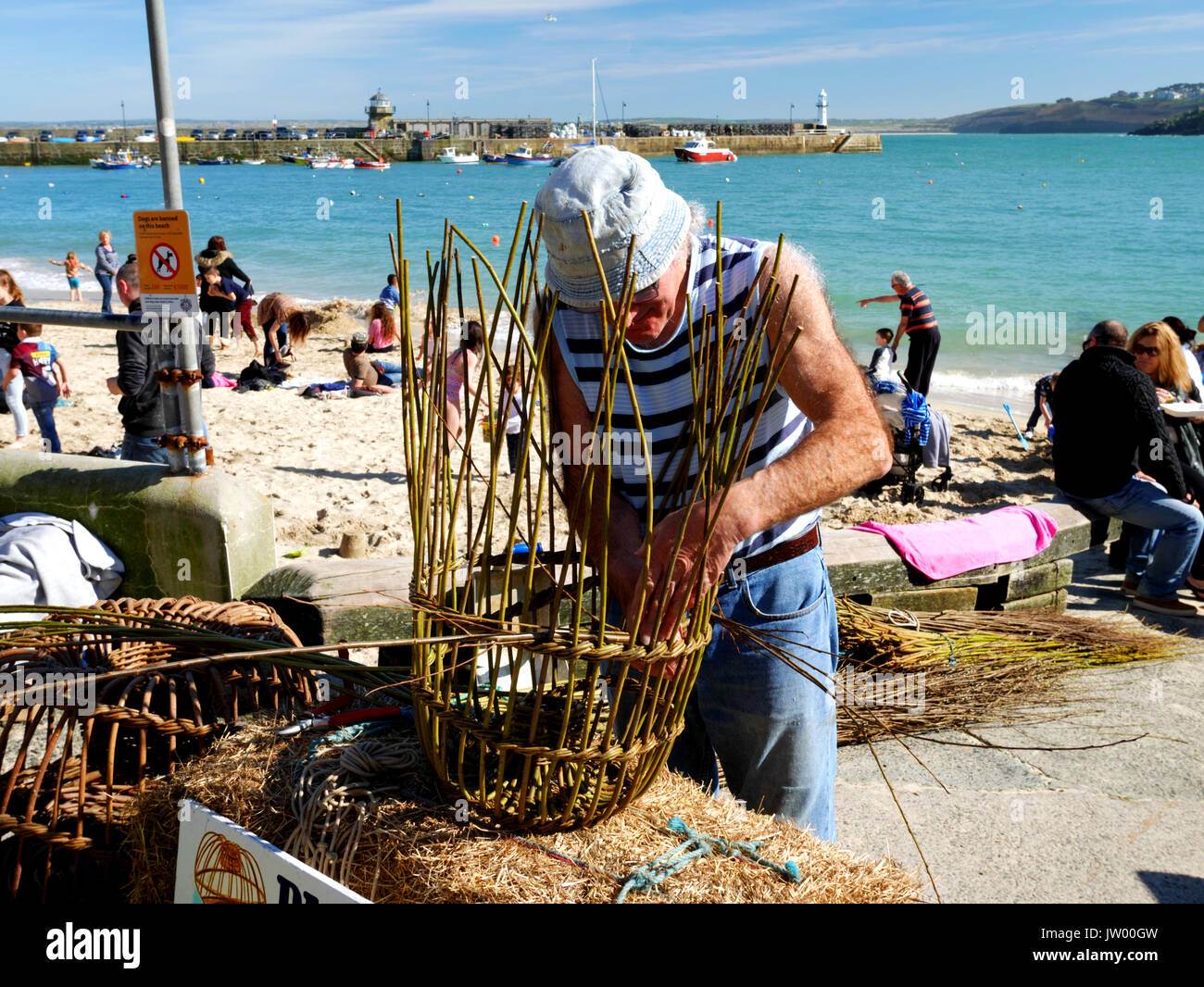 Cornish withy crab pot maker Richard Ede demonstrating his craft at St Ives, 25th March 2017. Stock Photo