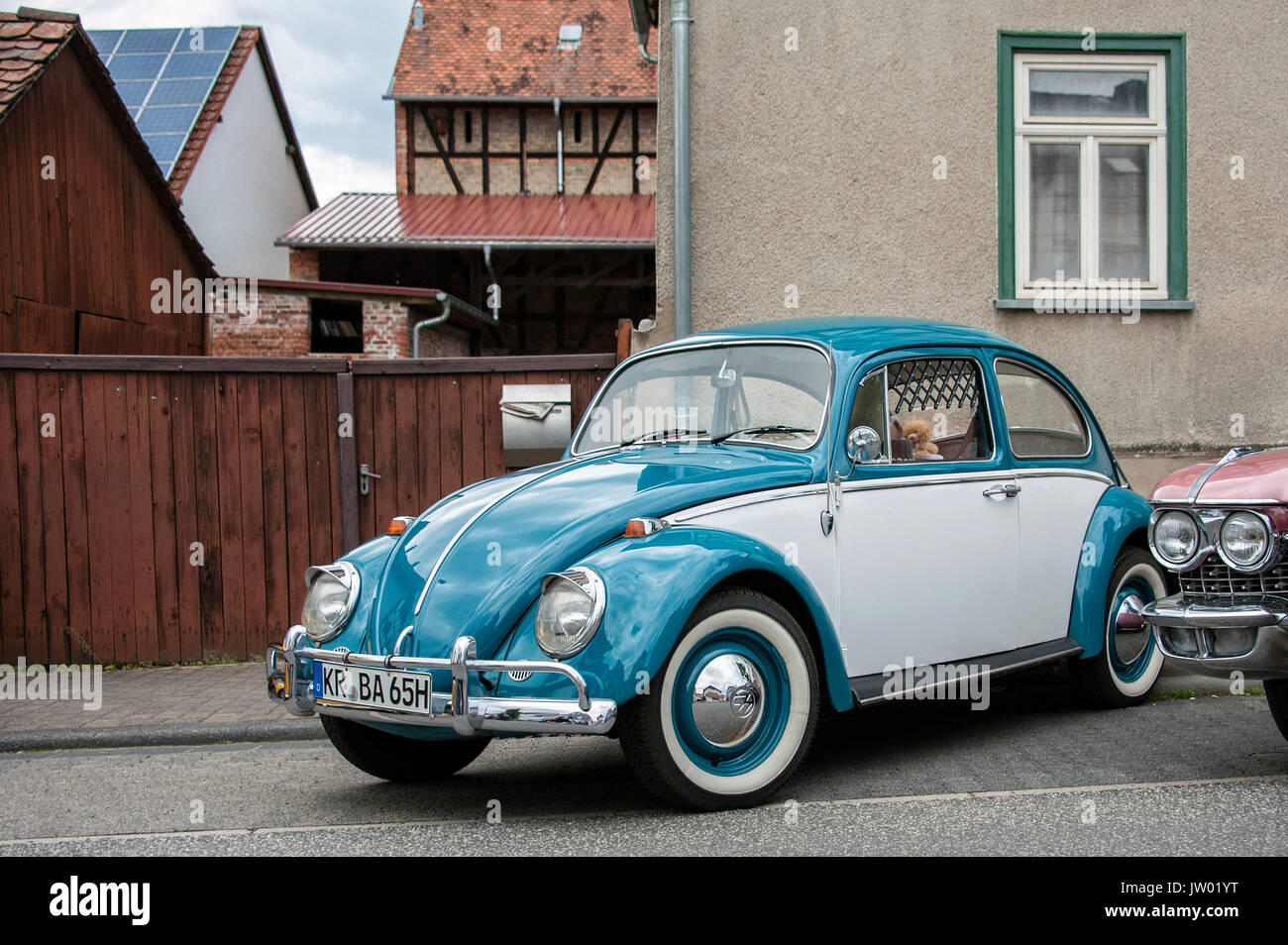 Vintage Car Festival "Golden Oldies", VW Beetle in front of a yard gate ...