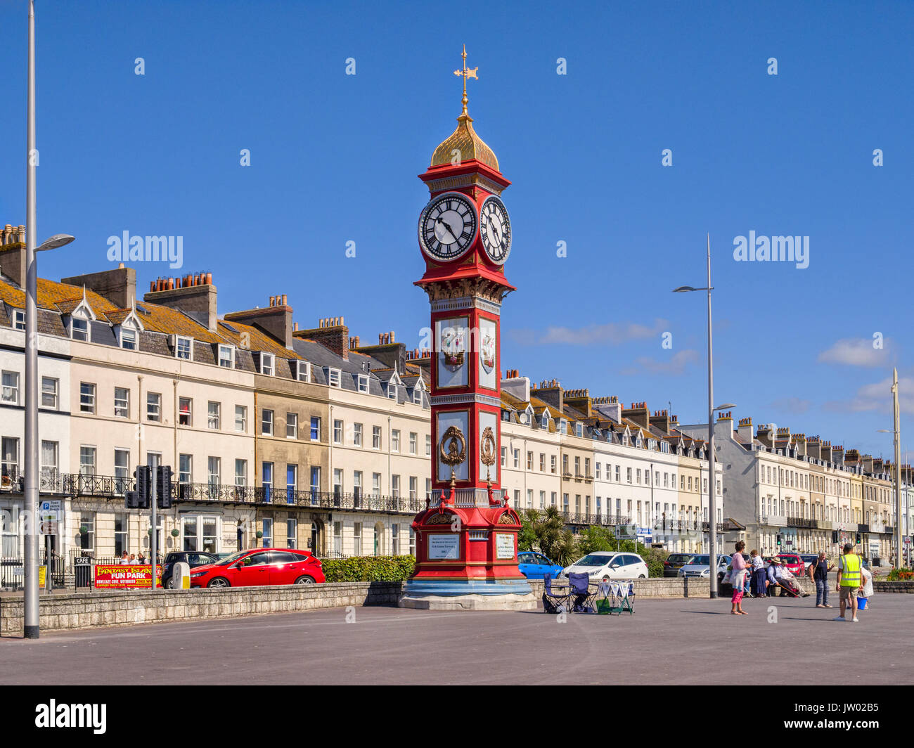 2 July 2017: Weymouth, Dorset, England, UK - The Jubilee Clock Tower on Weymouth Promenade on a beautiful sunny day with clear blue sky. Stock Photo