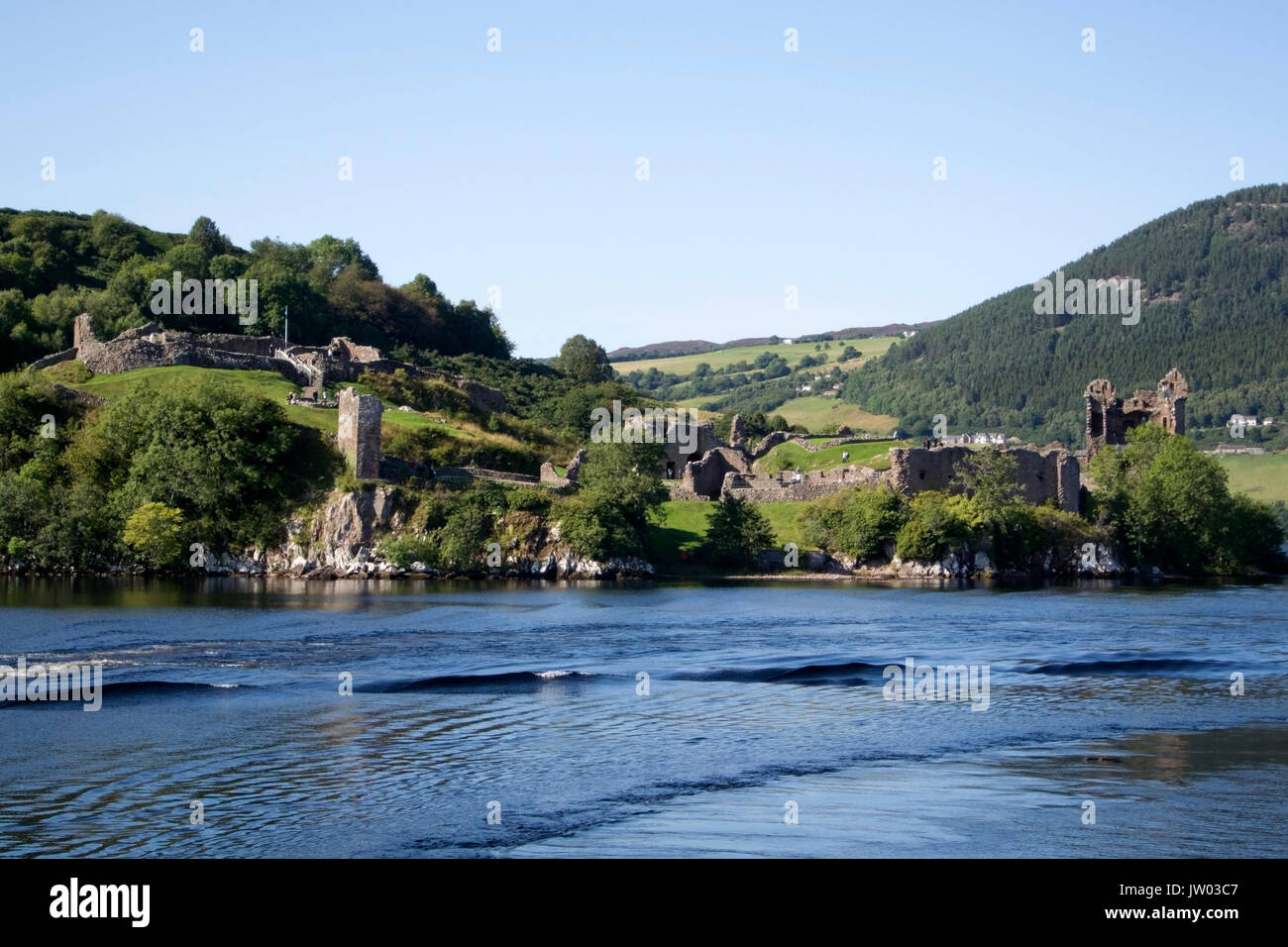 Historic Ruined Urquhart Castle Loch Ness Scotland landscape view of rocky promontory Strone Point and ruins of 13th to 16th century Urquhart Castle G Stock Photo