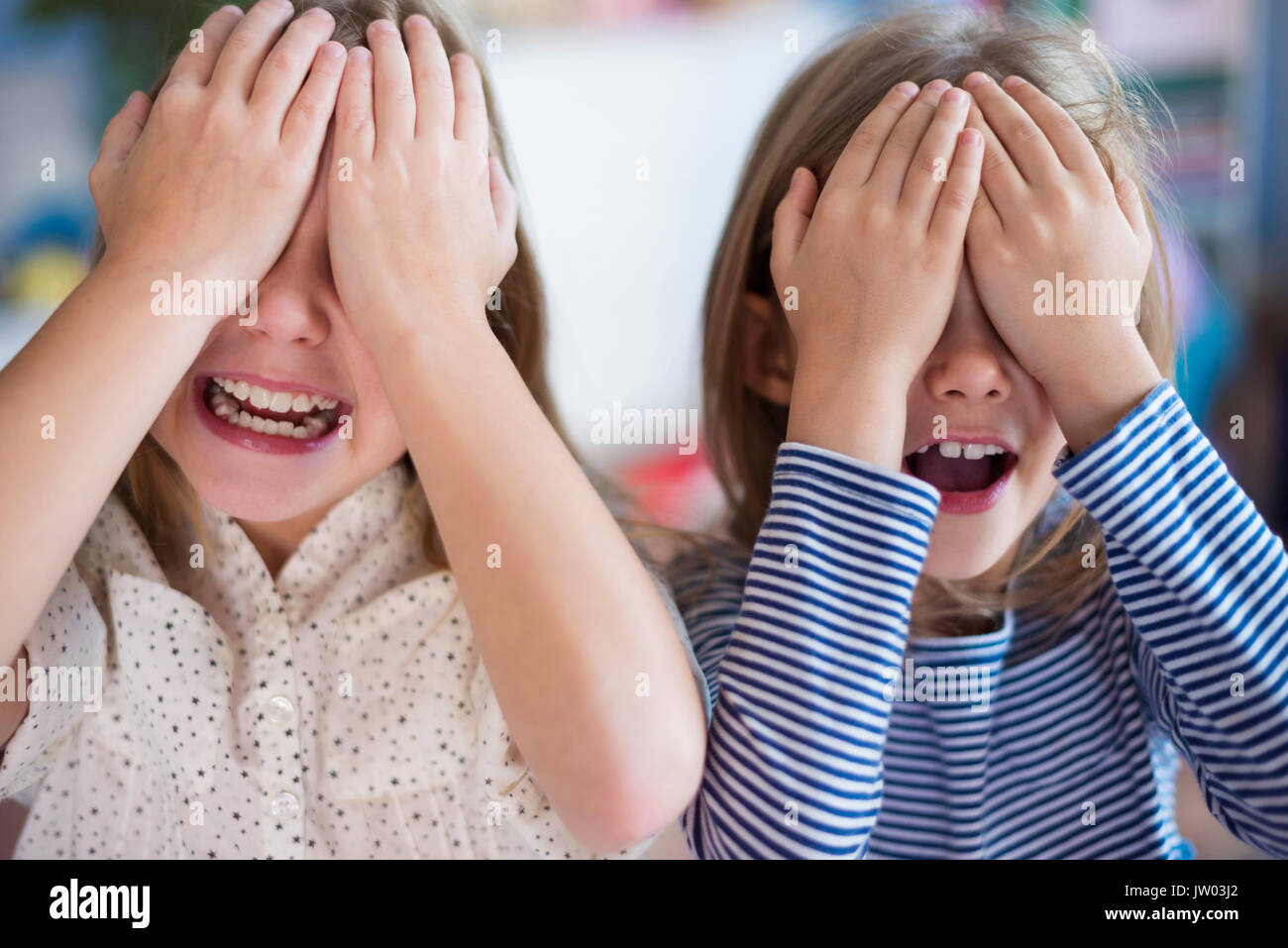 Two sisters play games - a Royalty Free Stock Photo from Photocase