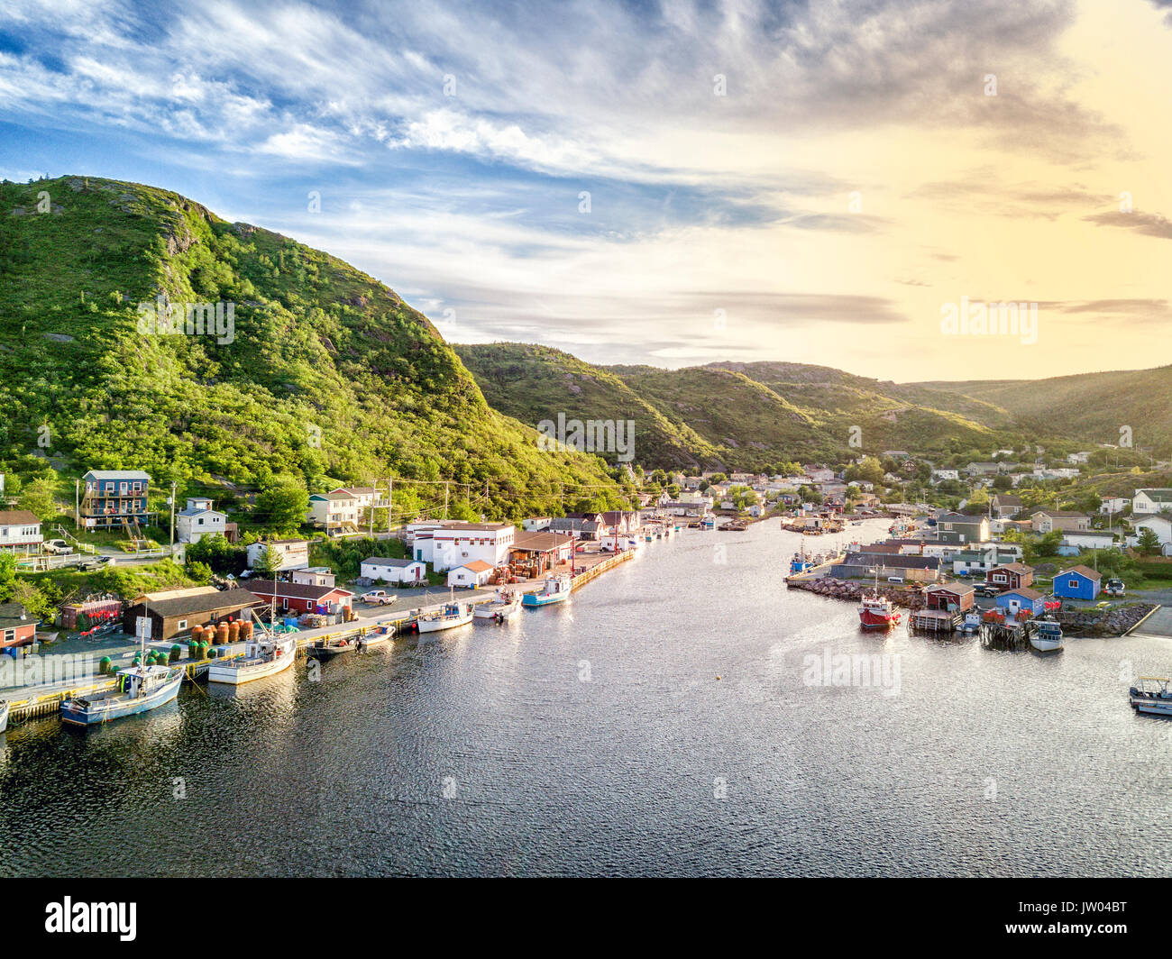 Charming Petty Harbour with green hills and colorful wooden architecture, Newfoundland, Canada Stock Photo