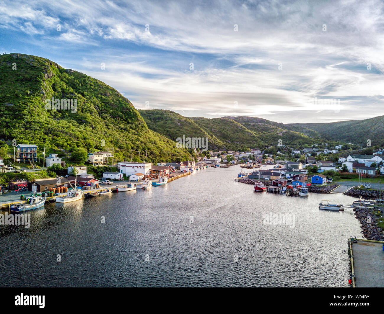 Charming Petty Harbour with green hills and colorful wooden