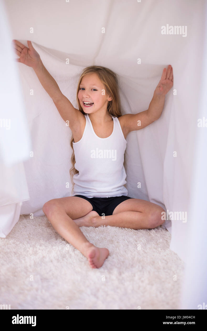 Hiding in her house made of duvet Stock Photo Alamy