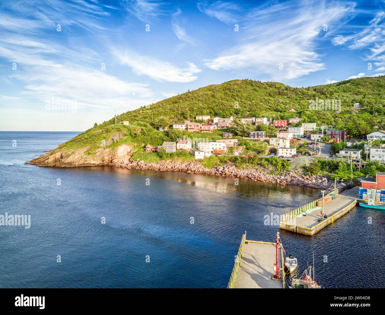 Beutiful Petty Harbour with two piers during summer sunset