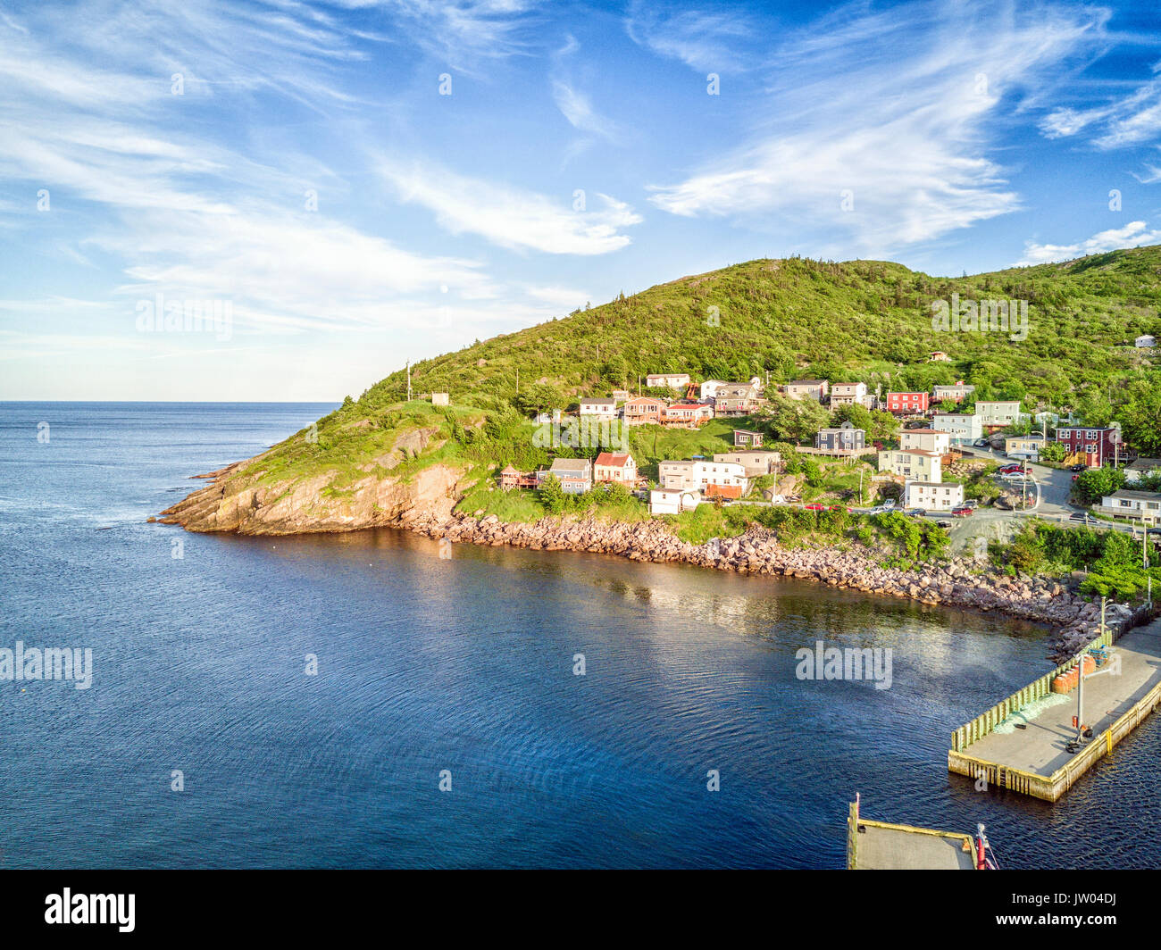 Beutiful Petty Harbour with two piers during summer sunset