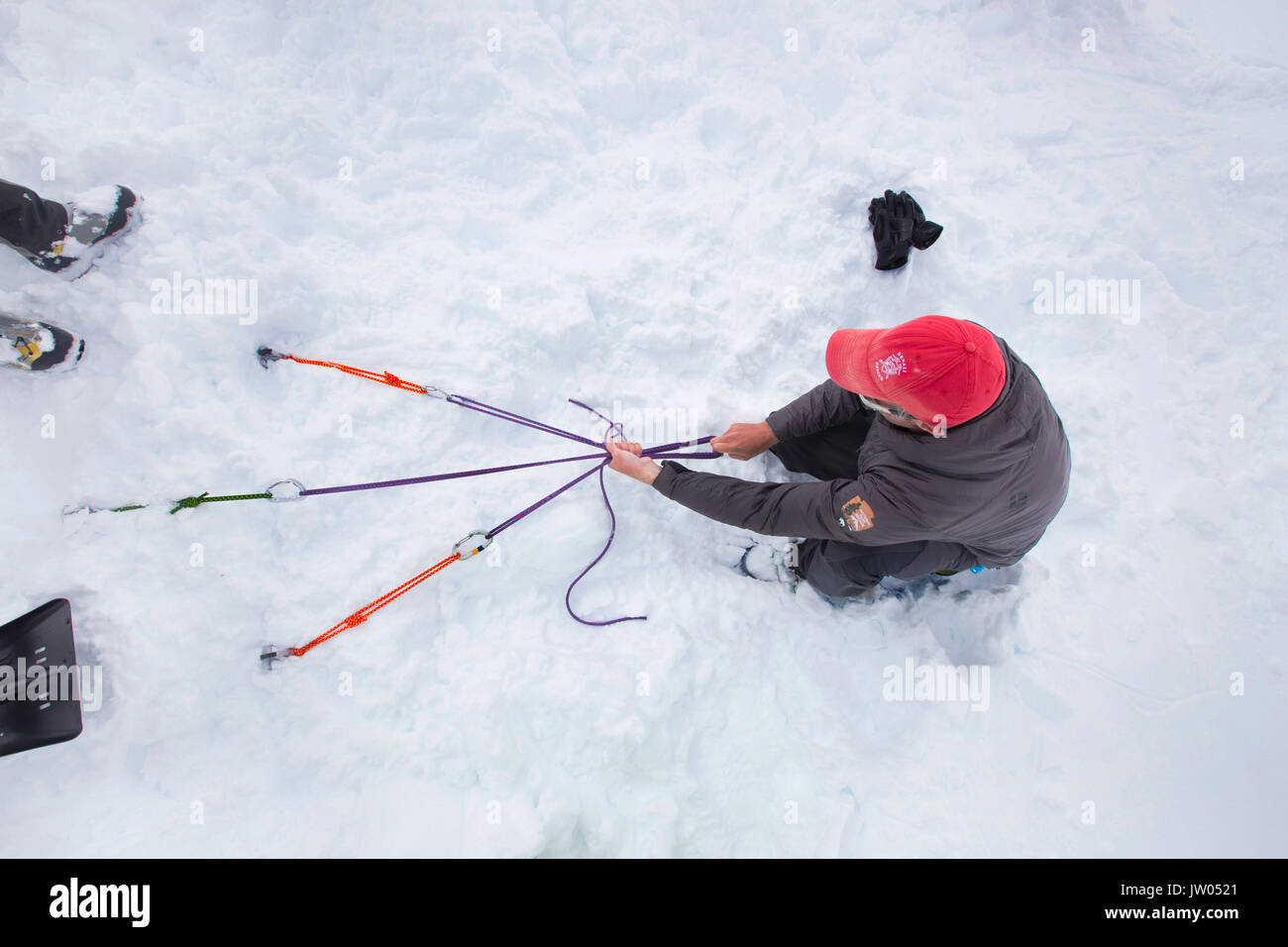 Denali National Park Service Ranger Dave Weber is showing rope techniques to Phunuru Sherpa. In 2009 the Nepalese mountain guide was the first to take part in the Sherpa Exchange Program, organized by the Khumbu Climbing Center to share mountaineering and rescue insights between Alaska and the Himalaya. In 2016 Phunuru came back to Denali. Stock Photo