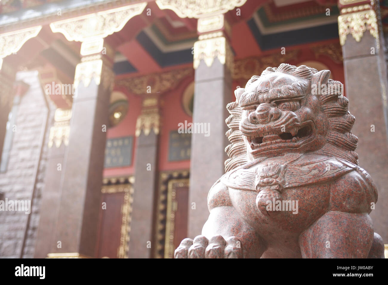 Detail of a Lamaism Datsan temple with stone lion sculpture Stock Photo