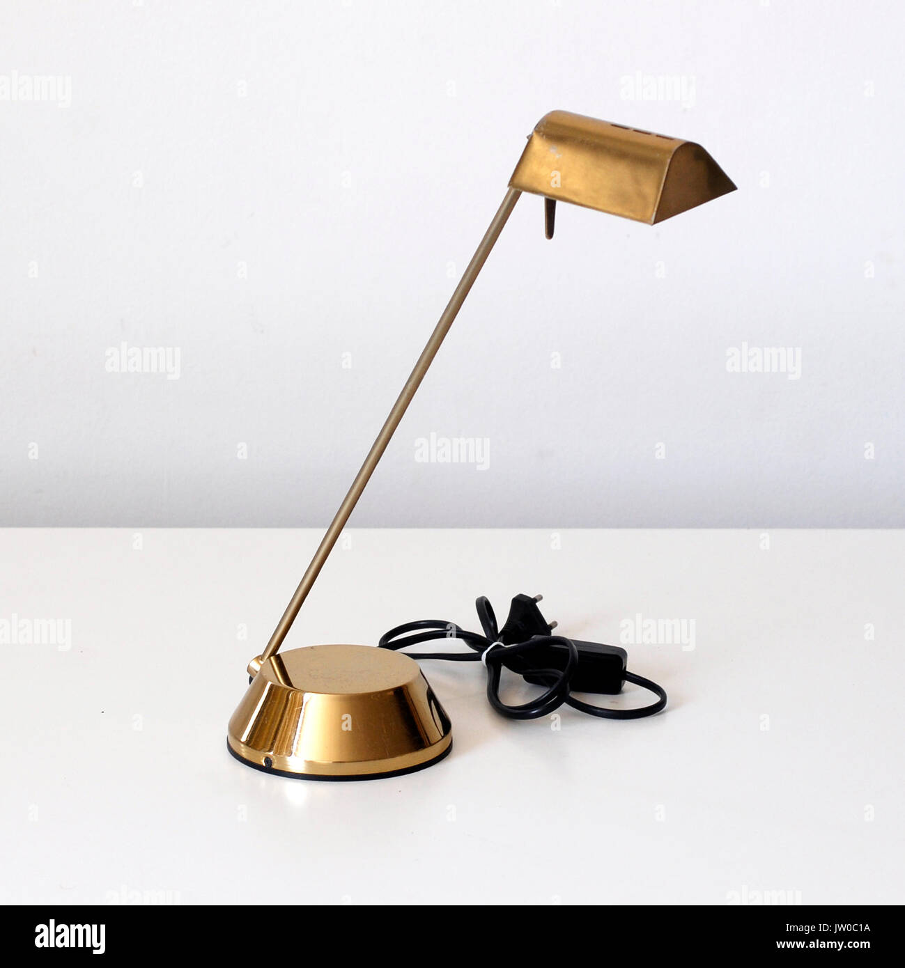 Vintage desk lamp. made by golden color metal. Brand Fase, Made in Spain.  Icon Stock Photo - Alamy